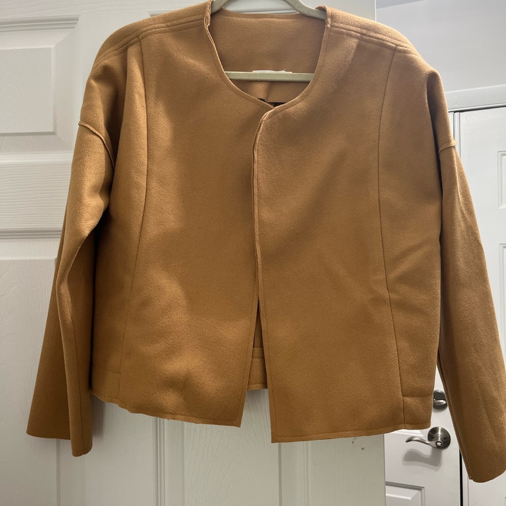 Cute cropped jacket. Great for layering